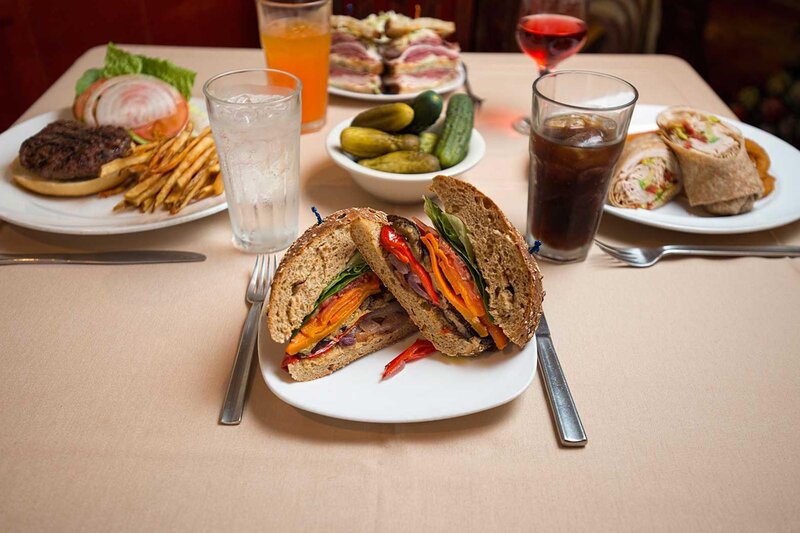Multiple sandwiches with focus on vegetable sandwich